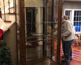 Magnificent oak curio cabinet, with full doors, plate glass shelves, mirrored back, and unbelievable carving. - Sun Lot #119
