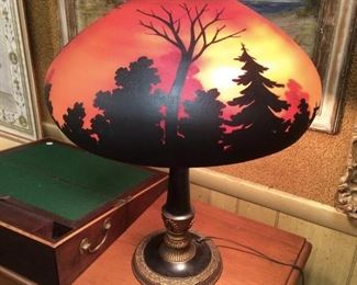 Vintage reverse painted table lamp. Absolutely stunning globe. Forest scene with red, yellow and orange sky. Trees painted in silhouette to show sunrise scene. A beautiful addition to any game room or library! - Sun Lot #136