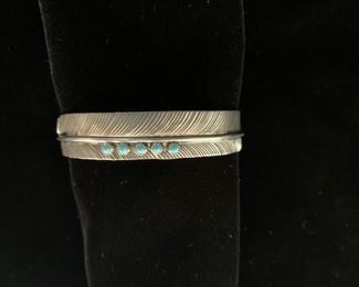 $100 (now $50) sterling and turquoise 'feather' cuff, hallmark DB