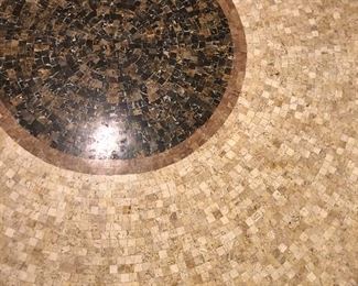 DETAIL OF MOSAIC TYPE STONE TOP TABLE ON METAL STAND