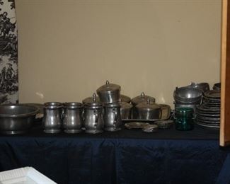 Pewter plates, mugs, bowls