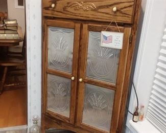 Corner cabinet with pierced panels