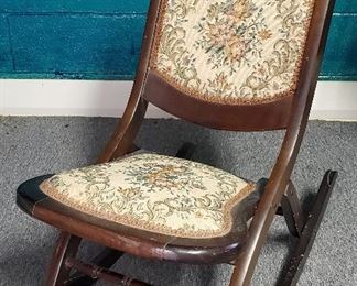 Antique folding nursery rocking chair rocker with needlepoint seat .
