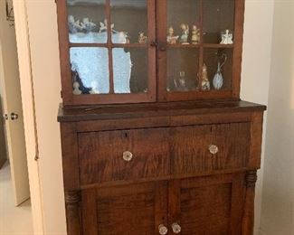 Item 1( was $1800) NOW $900 19th Century Antique Cabinet. It measures approximately 42.25" W by 80" H by 20.25" D.There is a surface crack on one pane of the glass.