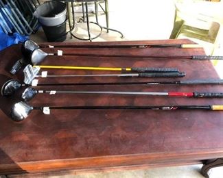 Large coffee table & golf clubs