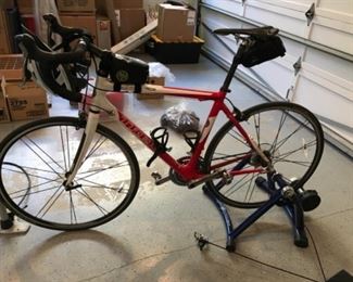Trek bike and stationary stand. Like new. Estimate $2500