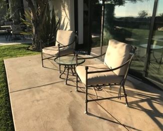 Cast patio chairs and table. Estimate $1200