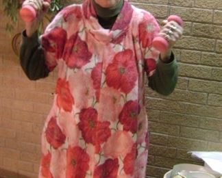 GRANNY IS EXERCISING IN HER [PLASTIC HAIR  NET FOR A WORK -OUT OF A SALE IN HER VINTAGE PINK TOWEL BATH ROBE