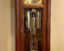 Item 107:  Howard Miller Grandfather Clock - beautiful condition - 19.5"l x 11"w x 81"h:  $795 
