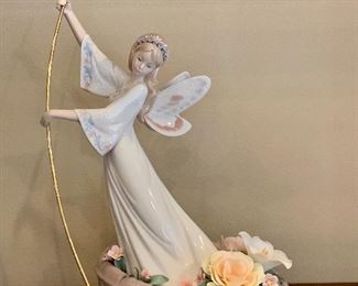 Item 60:  Lladro 7679, Enchanted Lake L.E.- 14.5" one of the flowers has come loose: $395