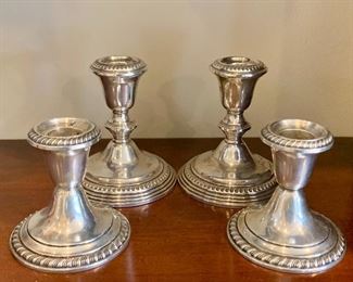 Item 97:  One pair of Gorham and one Empire weighted sterling silver candle sticks:  $35/Pair                                                        Gorham - 3.5"                                                                                                       Empire - 4.5"