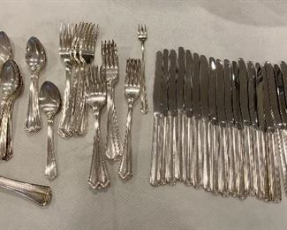 Item 125:  Oneida Hotel silverware set:   $85                                                         22 knives, 23 forks, 27 teaspoons, 5 soup spoons, 1 pickle fork