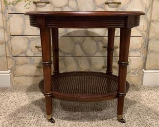 Item 225:  Ethan Allen caned oval side table with brass casters - 28"l x 23.25"w x 25"h:  $225