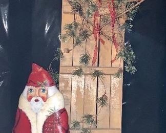 Item 239:  Leather painted Santa (signed) & sled:  $86 for both                                                                                                        Santa - 26"                                                                                                                  Sled - 52"
