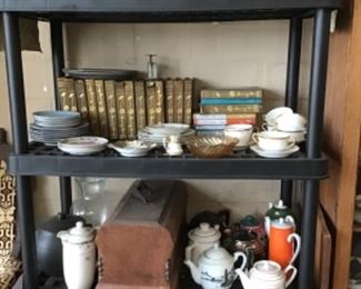 Ruby red glass, books,teapots