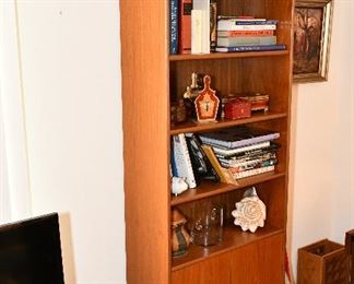 Teak Bookshelf. 29.5 x 12 x 5. 5 shelves plus 1 behind door. Was $295, now $195.