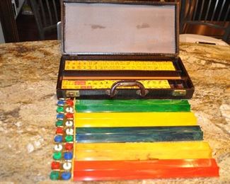VINTAGE 1960'S BAKELITE MAH JONGG SET INCLUDES 154 TILES, ALLIGATOR CARRYING CASE (SOME NOTICEABLE WEAR ON CORNERS), 5 RACKS AND CHIPS. OUR PRICE $165.00