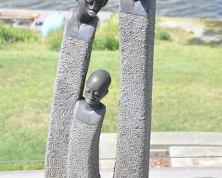 PRICE REDUCED!!  WONDERFUL STONE OUTDOOR SCULPTURE, "COMFORTING" BY ZIMBABWE ARTIST JOE MUTASA. 14.5” W X 7”D x 41”H. OUR PRICE $950.  