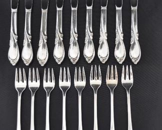 PRICE REDUCED!!  SET OF 9 INTERNATIONAL STERLING , "RHAPSODY" BUTTER KNIVES. OUR PRICE $150.00. SET OF 8 STERLING SEAFOOD/APPETIZER FORKS. OUR PRICE $175.00