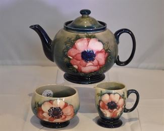 PRICE REDUCED!!  RARE VINTAGE MOORCROFT TEAPOT, CREAMER AND OPEN SUGAR. TEAPOT IS 6"H, CREAMER IS 3.25"H AND SUGAR IS 2.75"H. OUR PRICE IS $400.00 
