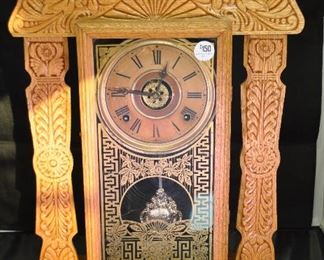 PRICE REDUCED!!  ANTIQUE CARVED GINGERBREAD 12 DAY CLOCK BY THE E. INGRAHAM CO. WITH KEY. AS IS. 14.5"W X 22.5"H X 4.75"D. OUR PRICE $120.00