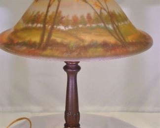 PRICE REDUCED!!  WONDERFUL VINTAGE REVERSE HAND PAINTED GLASS SHADE WITH BRONZE BASE TABLE LAMP DEPICTING AN AUTUMN SCENE. OUR PRICE $150.00