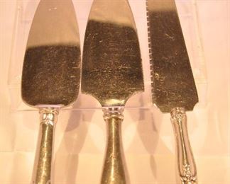 PRICE REDUCED!!  THREE STERLING HANDLE CAKE SERVER AVAILABLE. TWO ARE WEBSTER, PLAIN HANDLE IS $20.00 AND THE ORNATE ONE IS $40.00. THE THIRD IS AN ANTIQUE THOMAS TURNER & CO. PRICED AT $38.00