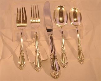 PRICE REDUCED!!   LOVELY INTERNATIONAL STERLING"RHAPSODY" 5 PIECE PLACE SETTING AS SHOWN. ONE HAS 12 PLACE SETTINGS WITH 7 SERVING PIECES (2435g.) AND ONE WITH 6 SETTINGS (1030g.)! SERVICE FOR 12 WITH THE SERVING PIECES IS PRICED AT  $3495.00. SERVICE FOR 6 PRICED AT $1400.00