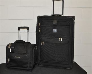 JOS. A BANK 29" BLACK NYLON SUITCASE, 3 EXTERIOR POCKETS AND AN INTERIOR SUIT BAG. OUR PRICE $85.00. ALSO SHOWN WITH A CIAO 14" BLACK NYLON ROLLER CARRY-ON WITH 2 INTERIOR AND 4 EXTERIOR POCKETS. OUR PRICE $35.00