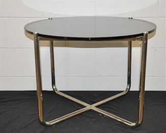 PRICE REDUCED!!  FABULOUS ROUND SMOKE GLASS TOP WITH CHROME BASE SIDE TABLE, 27” ROUND X 20” H. OUR PRICE $100.00