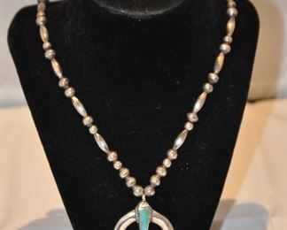 SOUTHWEST INDIAN SILVER AND TURQUOISE PENDANT STRUNG WITH SILVER BEADS. 55.0G. OUR PRICE $150.00
