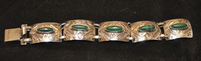5 SECTION HINGED SILVER BRACELET EACH WITH A MALACHITE STONE. 38.0G. OUR PRICE $125.00