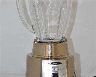 OSTER SILVER BLENDER, MODEL BCCG08, 450 WATT 8 SPEED 6 CUP BLENDER WITH GAR JAR AND BLADE. OUR PRICE $40.00