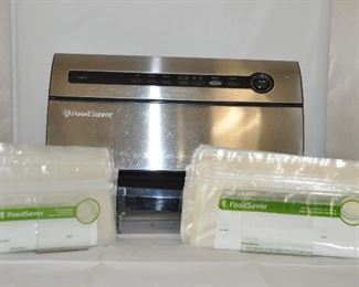 FOOD SAVER WITH STORAGE BAGS, MODEL V3825. OUR PRICE $60.00