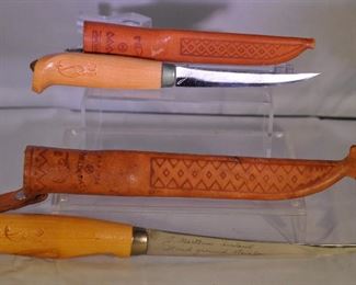 PAIR OF RAPALA J. MARTINI FISH FILET KNIVES MADE IN FINLAND WITH LEATHER SHEATHS. ONE HAS A 4" BLADE AND THE OTHER HAS A 6" BLADE. OUR PRICE $30.00 PAIR  