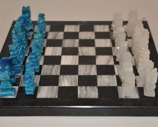 PRICE REDUCED!  SMALL VINTAGE 11” SQUARE BLACK AND WHITE ONYX CHESS BOARD WITH TURQUOISE AND WHITE CARVED CHESS PIECES (KING IS 2.5” H). MADE IN MEXICO. SOME SCRATCHES. OUR PRICE $40.00