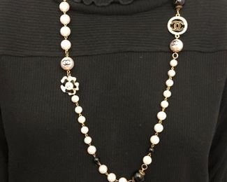 36” FAUX PEARLS WITH CHANEL LOGO ON GOLD TONE NECKLACE. OUR PRICE $85.00