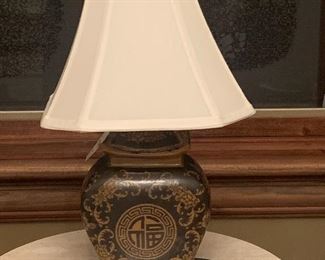PETITE ASIAN STYLE CERAMIC BLACK AND CARMEL COLORED LAMP WITH IVORY SILK SHADE. OUR PRICE $85.00