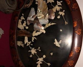 One of a pair of mother of pearl and lacquer large plaques