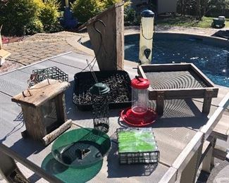 Lots of bird feeder equipment supplies