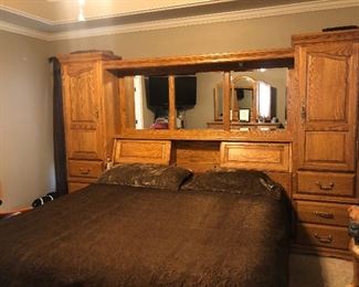 King size bed set.... Headboard with tons of storage, drawers under the bed, dresser included. The sides have a place to hold jewelry as does the dresser mirror. 