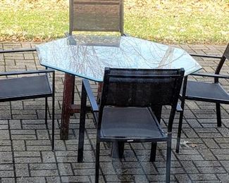 Glass top patio table & four nice chairs