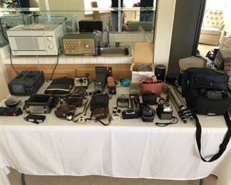 Lots of vintage cameras, video equipment, projectors