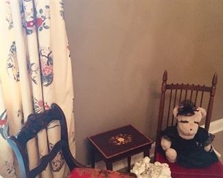 we have cute occasional chairs, small tables, and notice the gorgeous draperies in every room