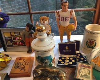 LSU decanters, placques, statues, framed prints, dancing tigers and a plaster #86  and boxed sets of English brass buttons
