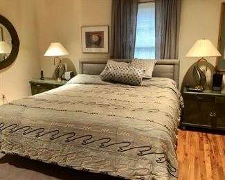 King bedroom with gray upholstered headboard 