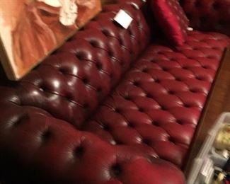 Wine red tufted leather sofa