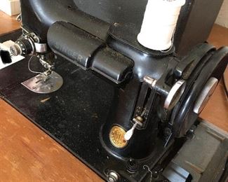 Featherweight Singer sewing machine in square sewing table