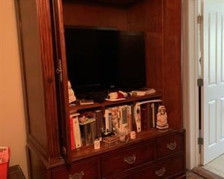 TV stand with drawers.  This is a very nice piece of furniture.  Bring muscle to move this!  $100