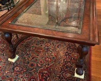 Thomasville Wood and Glass Coffee Table - this table is approximately 40 inches wide and 60 inches long.  This extremely nice coffee table is priced at $350.